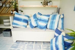 Shed detail: Couch with blue throw pillows.